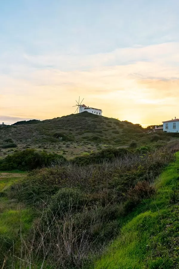 Windmill on the top of the hill during glorious sunset  Flip 2019