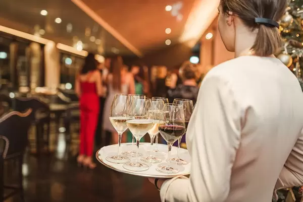 Wine Plate Holding By Waitress In Restaurant