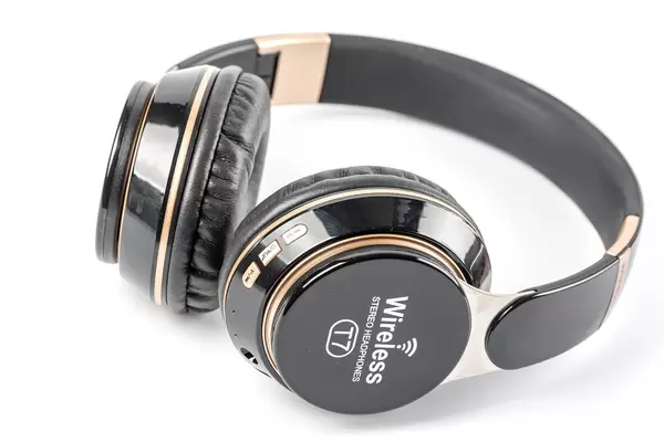 Wireless black headphones on white background