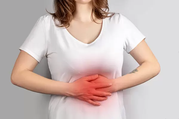 Woman experiencing abdominal pain, treatment and prevention concept