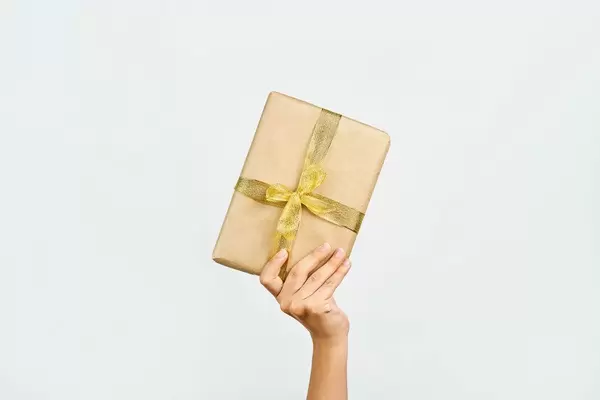 Woman hand holding a Christmas giftbox