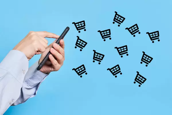 Woman hand holding smartphone and purchasing grocery or clothing in online shop