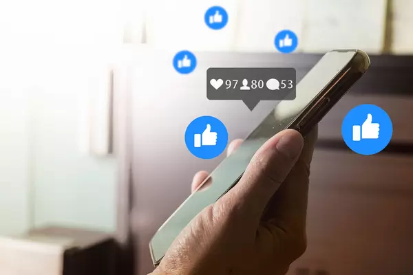 Woman hand using social media - Online marketing concept