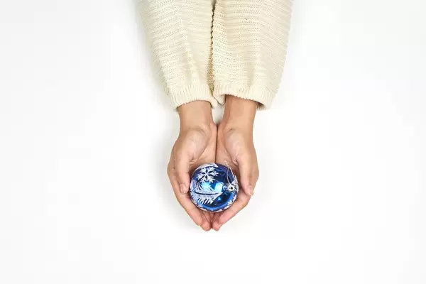 Woman holding a christmas decoration