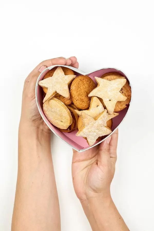 Woman holding box of cookies