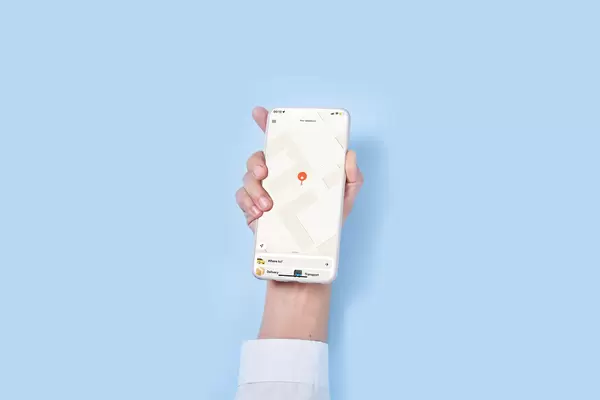 Woman holds smartphone with taxi service mobile application and calling taxi