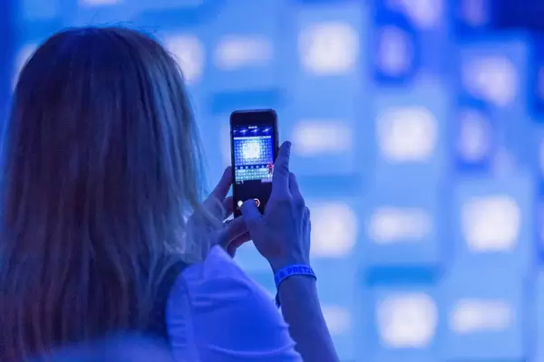 Woman makes a photo with smartphone