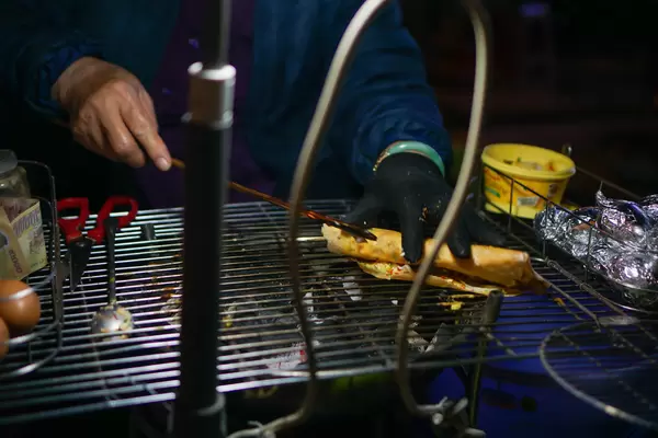 Woman preparing a popular Vietnamese Snack in Dalat, Vietnam