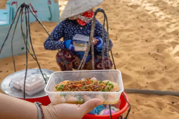 Woman selling Food at the Entrance of the Red Sand Dunes in Mui Ne  Flip 2019