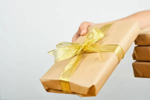 Woman sharing a christmas gift