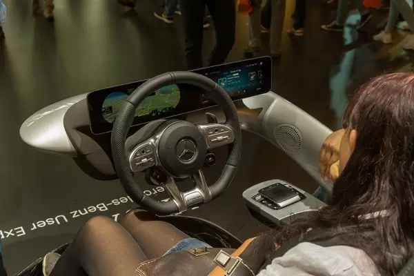 Woman tests the Mercedes Benz user experience MBUX, infotainment system for the new A-Class
