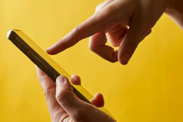 Woman touching smartphone display
