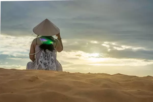 Woman watching the Sunset in the Red Sand Dunes of Mui Ne, Vietnam  Flip 2019