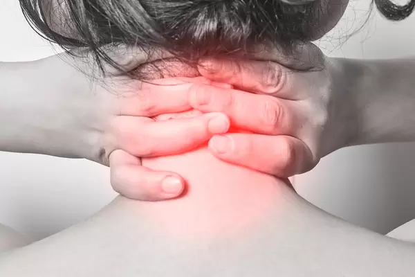 Woman with pain in her back and neck