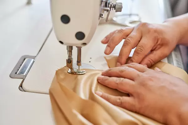 Woman working on sewing machine