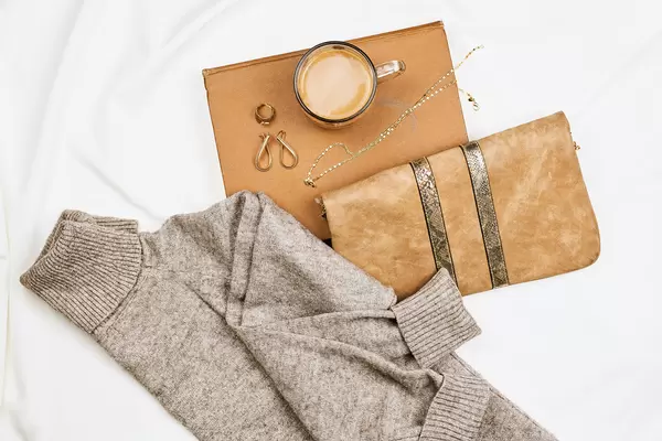 Women's clutch, sweater and jewelry