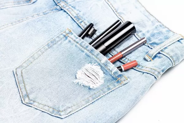 Women's cosmetics in the pocket of jeans (Flip 2020)