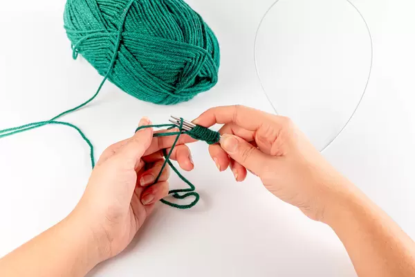 Women's hands and the process of knitting