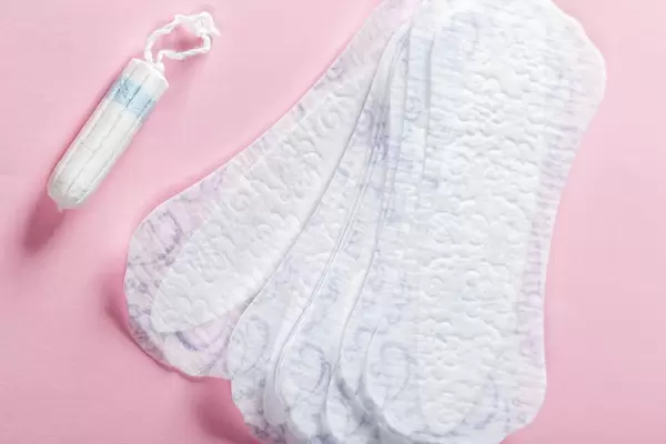 Women's sanitary supplies on a pink background