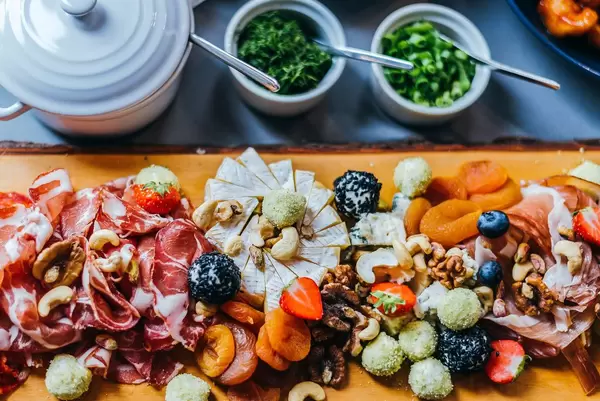 Wood Plate of Meat and Cheese Snacks