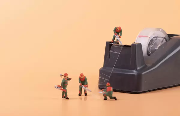 Wood workes with black tape dispenser cutter