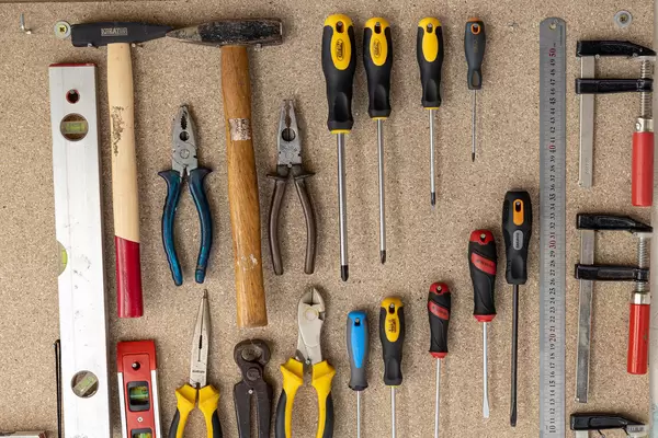 Wooden board with hanged hand tools