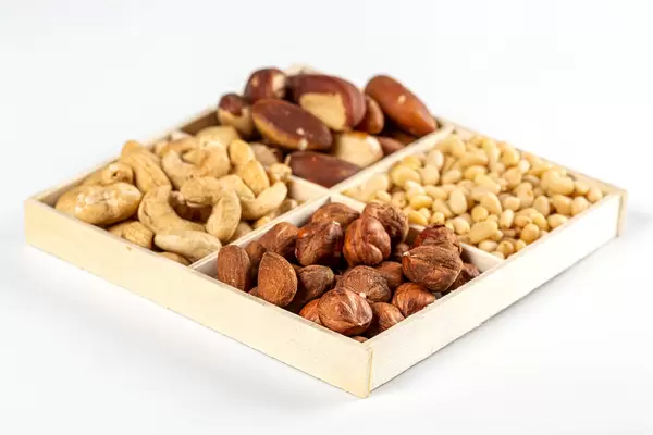 Wooden box with a selection of different types of delicious nuts