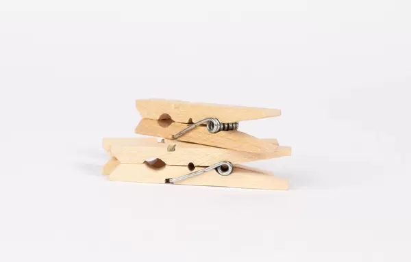 Wooden clothes pins on white background  Flip 2019