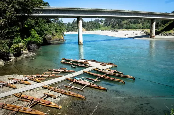 Wooden conoes near a river mouth