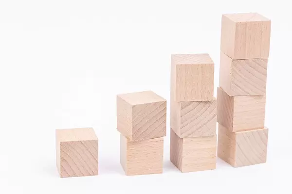 Wooden Cubes stairs with copy space above white background