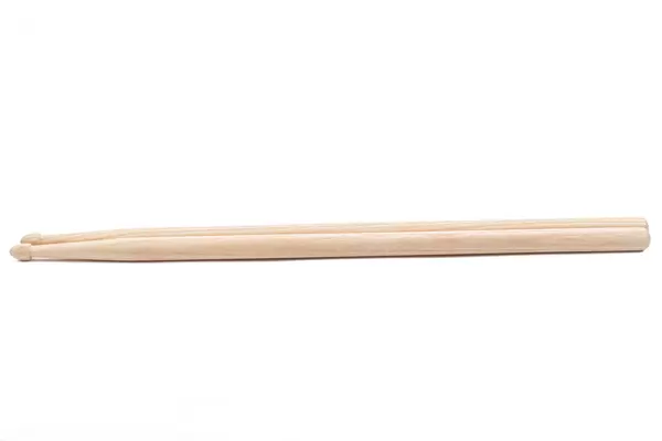 Wooden Drumsticks above white background with copy space