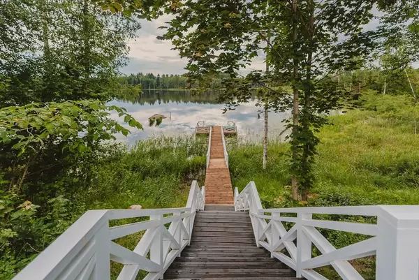Wooden Footbridge Of Lake