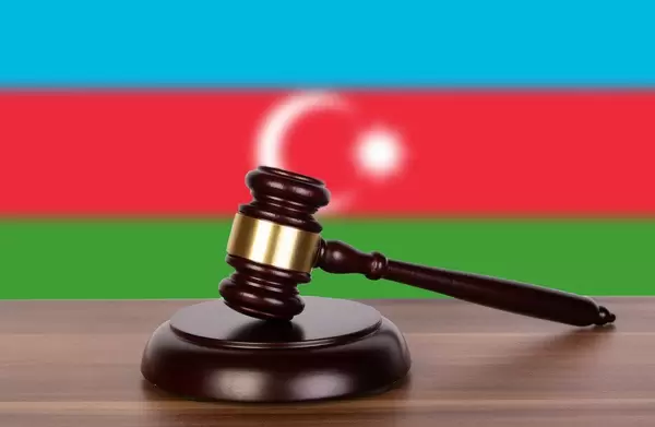 Wooden gavel and flag of Azerbaijan
