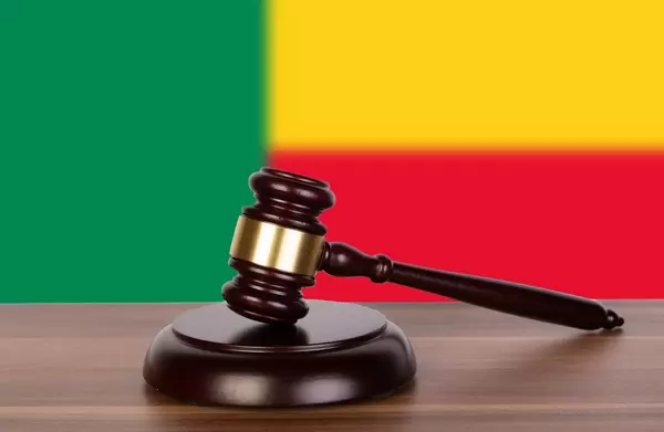 Wooden gavel and flag of Benin