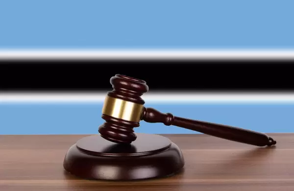 Wooden gavel and flag of Botswana