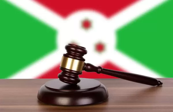 Wooden gavel and flag of Burundi