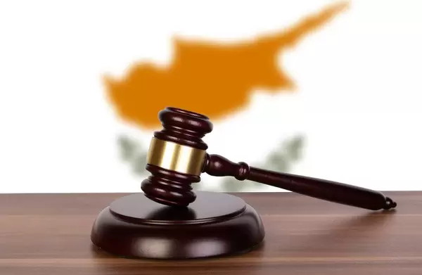 Wooden gavel and flag of Cyprus