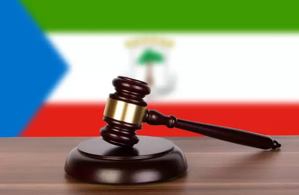 Wooden gavel and flag of Equatorial Guinea