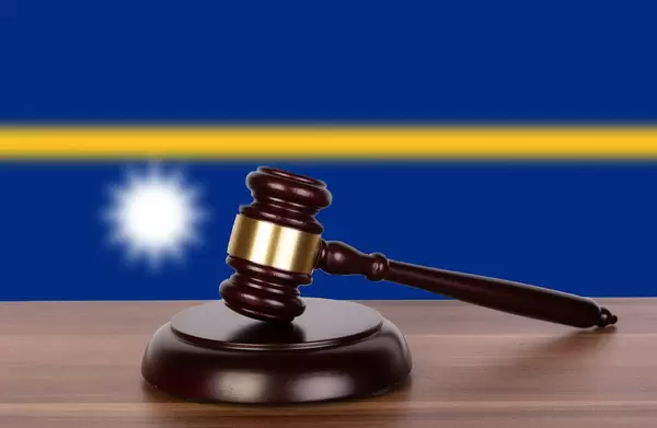 Wooden gavel and flag of Nauru