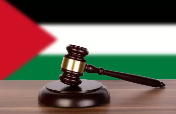 Wooden gavel and flag of Palestine State