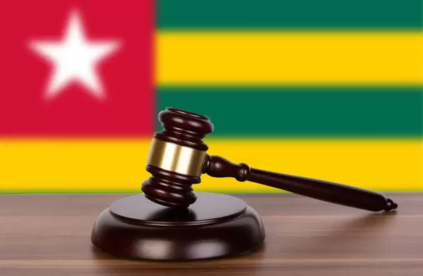 Wooden gavel and flag of Togo