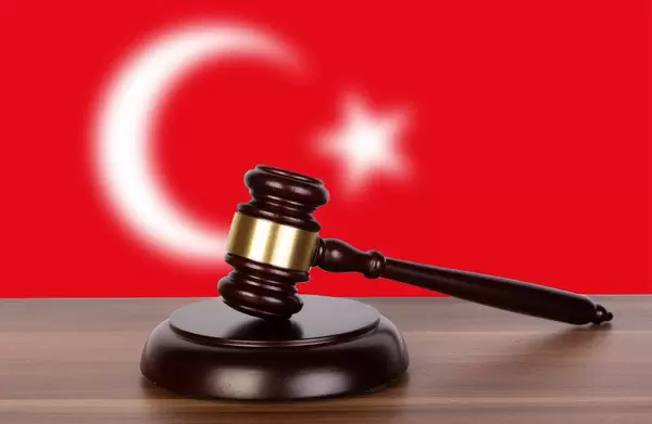 Wooden gavel and flag of Turkey
