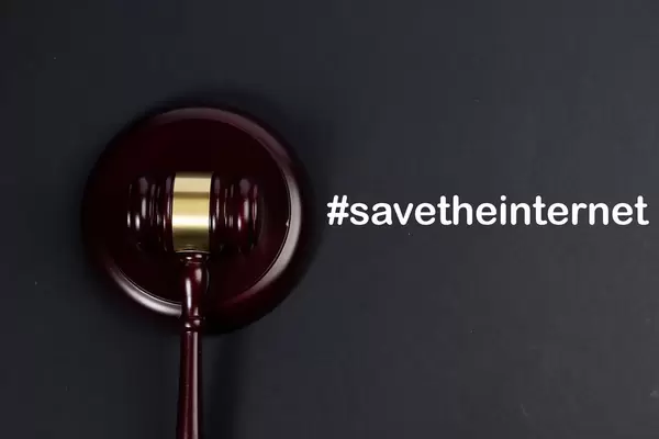 Wooden gavel with #savetheinternet text