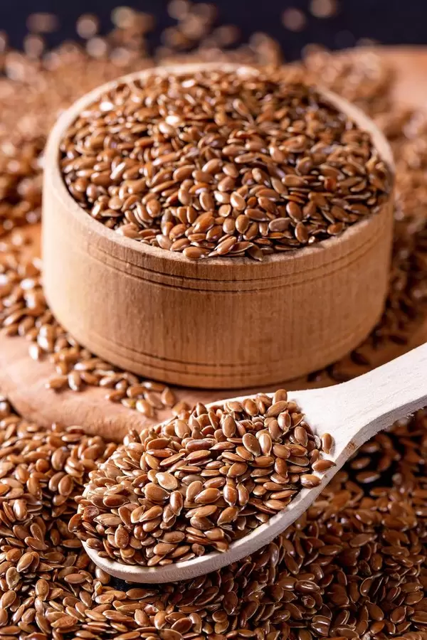 wooden spoon with flax seed placed