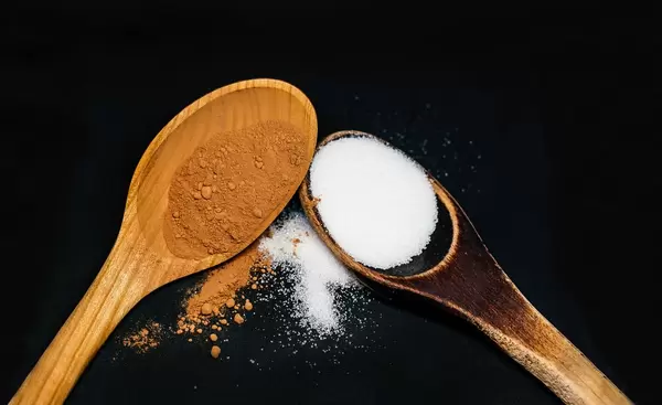 Wooden Spoons Of Cacao and Sugar