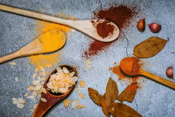 Wooden spoons with spices.