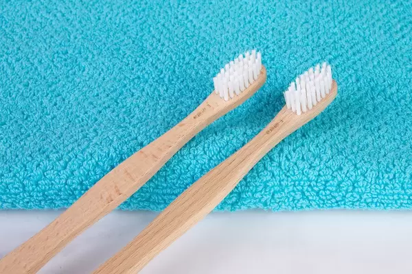 Wooden toothbrushes on towel (Flip 2019)