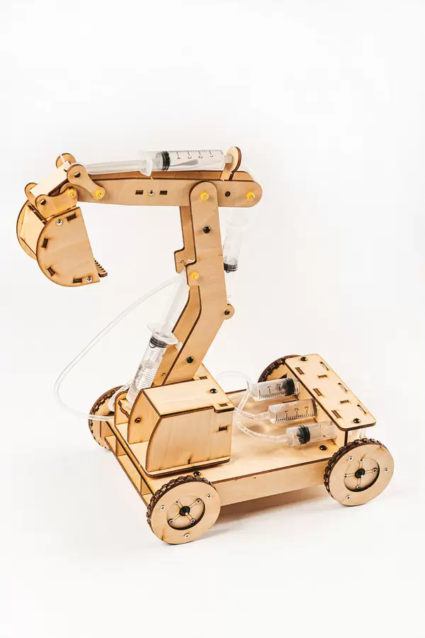 Wooden toy excavator on white background