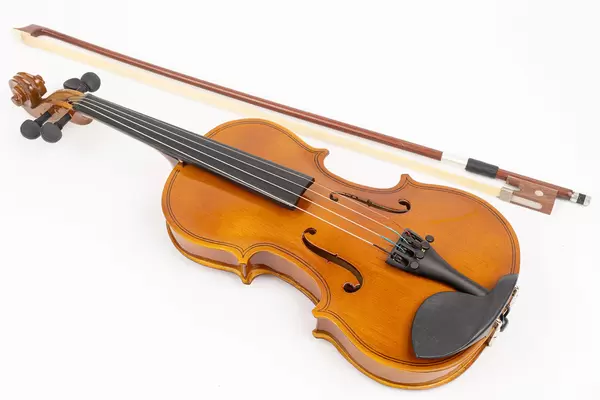 Wooden Violin with Fiddle Bow isolated above white background