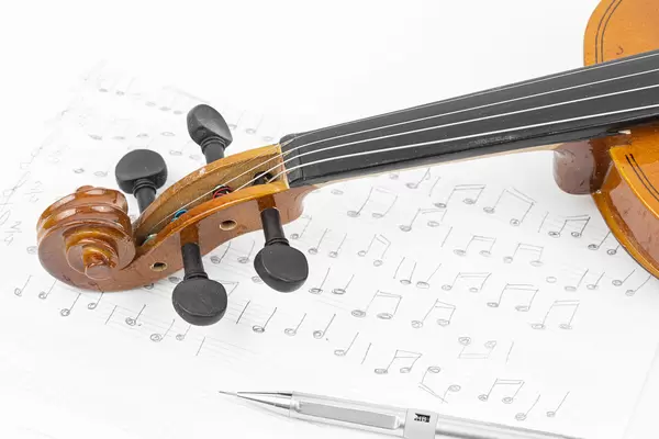 Wooden Violin with Notes on the sheet music